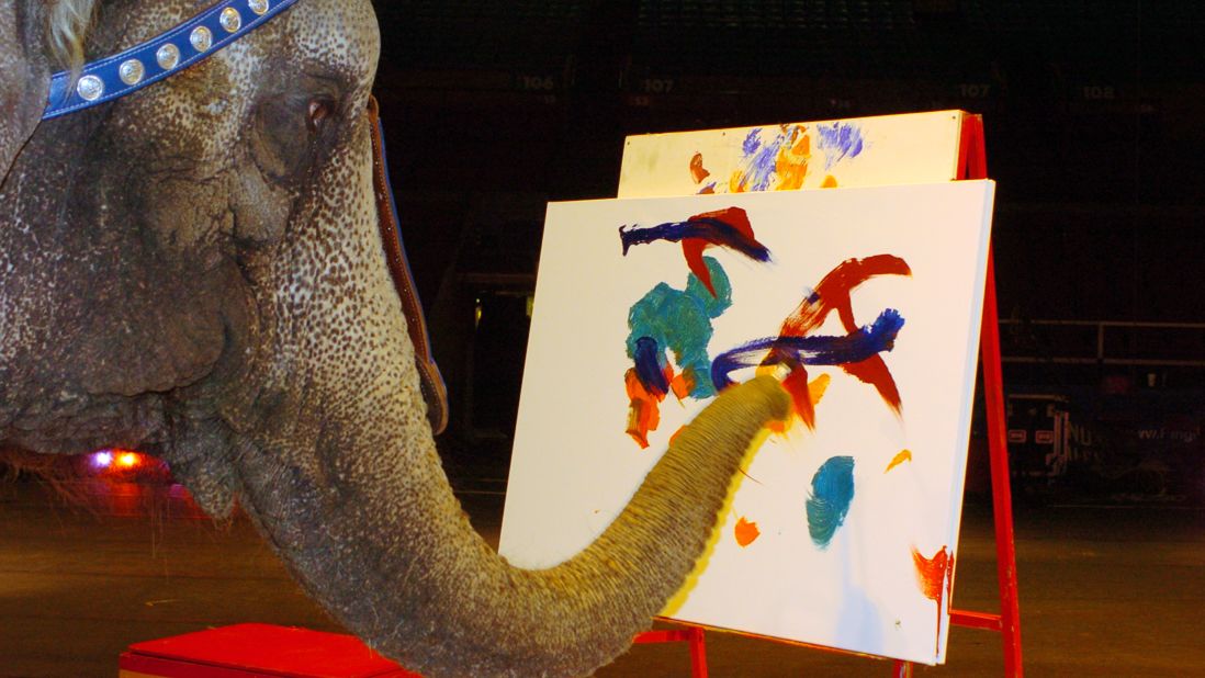 Nicole, a 31-year-old elephant, shows off her artistic talent in 2006 as she paints for children of the local Ronald McDonald House in New York.