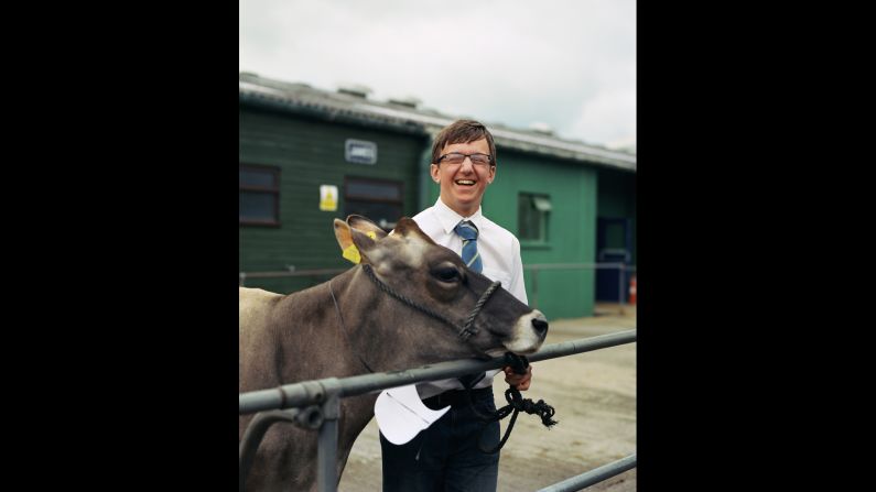 Jamie, 15, prepares to exhibit his Jersey cow at a livestock show in Somerset, England. Photographer Jooney Woodward thought his cheerfulness showed that "sense of enjoyment" handlers have when competing with their animals.