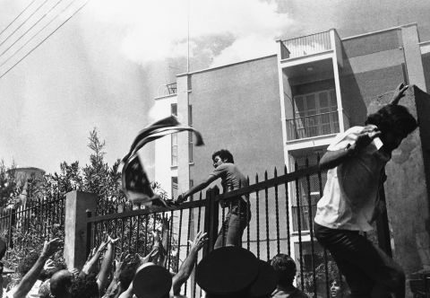 Angry demonstrators rip the American flag from the United States Embassy in Nicosia, Cyprus, on August 19, 1974, during a demonstration against American policy on Cyprus. Rodger Davies, the U.S. ambassador to Cyprus, was killed by gunfire during the incident.