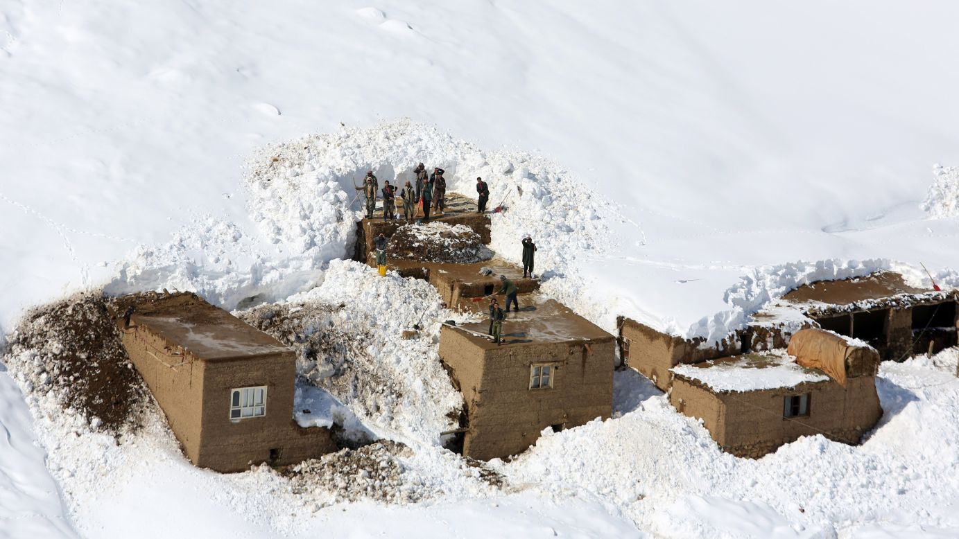 Afghans stand on the roof of a home damaged by an avalanche in Panjshir province, north of Kabul, Afghanistan, on Friday, February 27. <a href="http://www.cnn.com/2015/03/02/asia/afghanistan-avalanche/index.html" target="_blank">Avalanches caused by heavy snowstorms </a>have killed at least 196 people in the mountainous province.