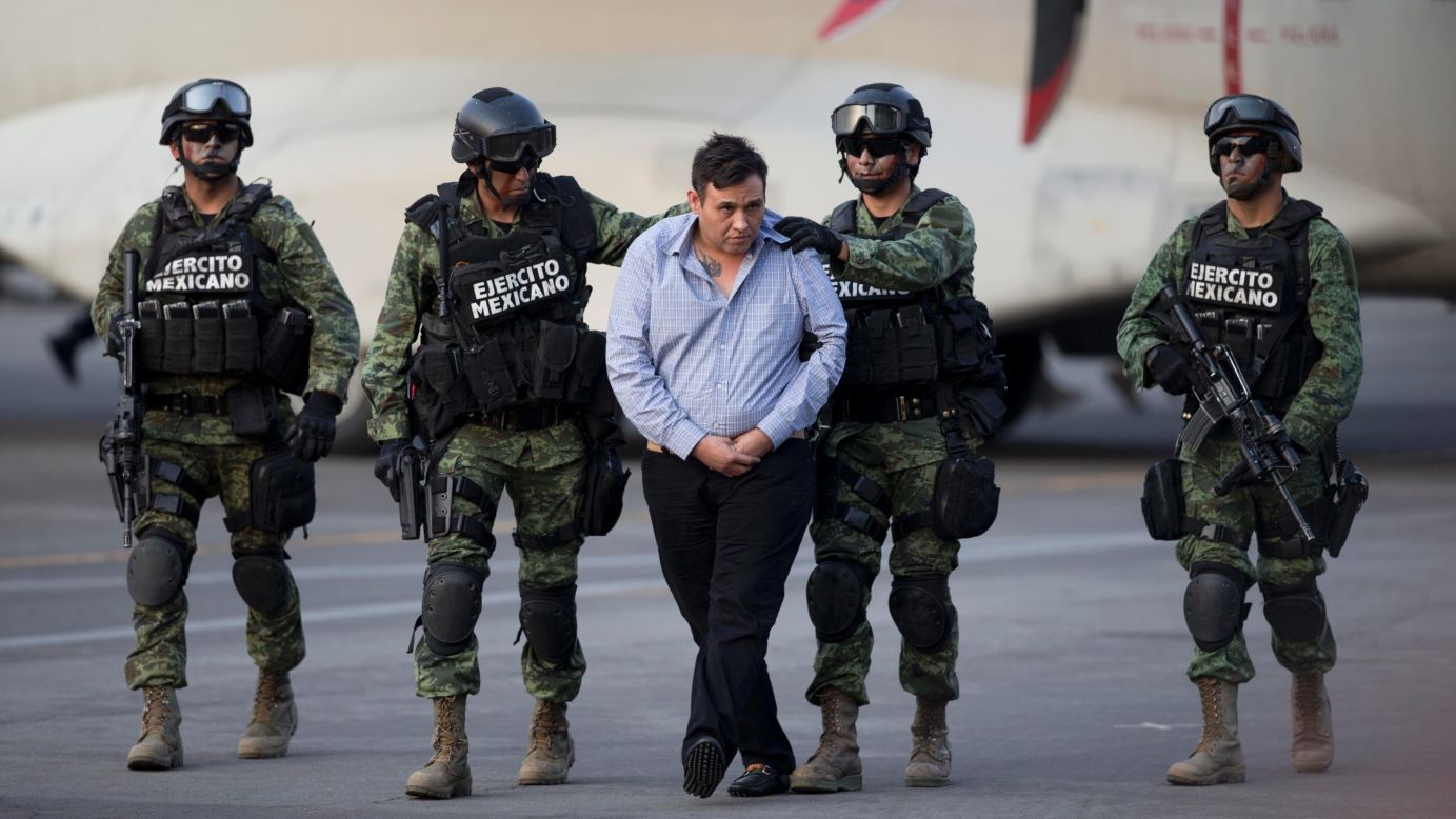 The alleged leader of the Zetas drug cartel, Omar Trevino Morales, is escorted by soldiers in Mexico City <a href="http://www.cnn.com/2015/03/04/americas/mexico-zetas-leader-captured/index.html" target="_blank">after he was captured</a> in an early morning operation on Wednesday, March 4. There are 11 pending criminal cases against him, and the crimes he is accused of committing make him "one of the most dangerous and bloodthirsty criminals in Mexico," said Tomas Zeron, director of criminal investigations for the Attorney General's Office.