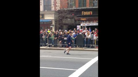 Eight-year-old <a href="http://www.cnn.com/2013/04/16/us/boston-boy-killed/" target="_blank">Martin Richard, the youngest victim</a>, can be seen standing on the rail in the front row.