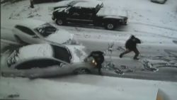 pkg car slides in snow hits person_00001302.jpg