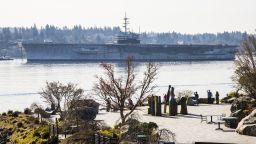 The former aircraft carrier USS Ranger is towed from Bremerton, Washington, on Thursday, March 5, 2015, on its final journey to a scrapyard in Brownsville, Texas.