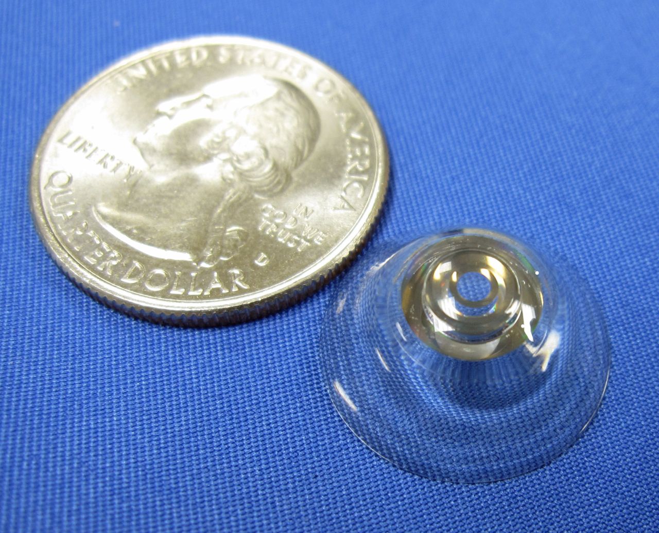 Scientists are developing a telescopic contact lens to magnify human vision, which could help people with age-related macular degeneration.