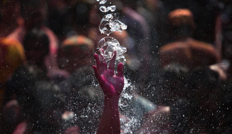 Water falls on a man dancing during Holi celebrations in Gauhati, India, on March 6.