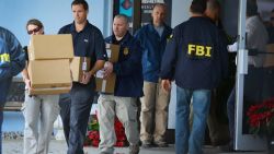 FBI agents carry out boxes as law enforcement officials investigate the medical-office complex of Dr. Salomon Melgen who has possible ties to U.S. Sen. Bob Menendez (D-NJ) on January 30, 2013 in West Palm Beach, Florida. The agents arrived last night at the medical-office complex and started hauling away potential evidence in several vans.
