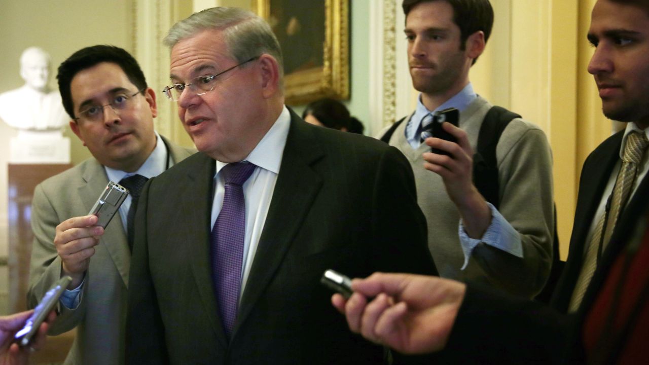 U.S. Sen. Robert Menendez (D-NJ) talks to reporters as he arrives at the weekly Senate Democratic Policy Committee luncheon March 25, 2014 at the Capitol in Washington, DC. Senate Democrats held its weekly policy luncheon to discuss Democratic agenda.