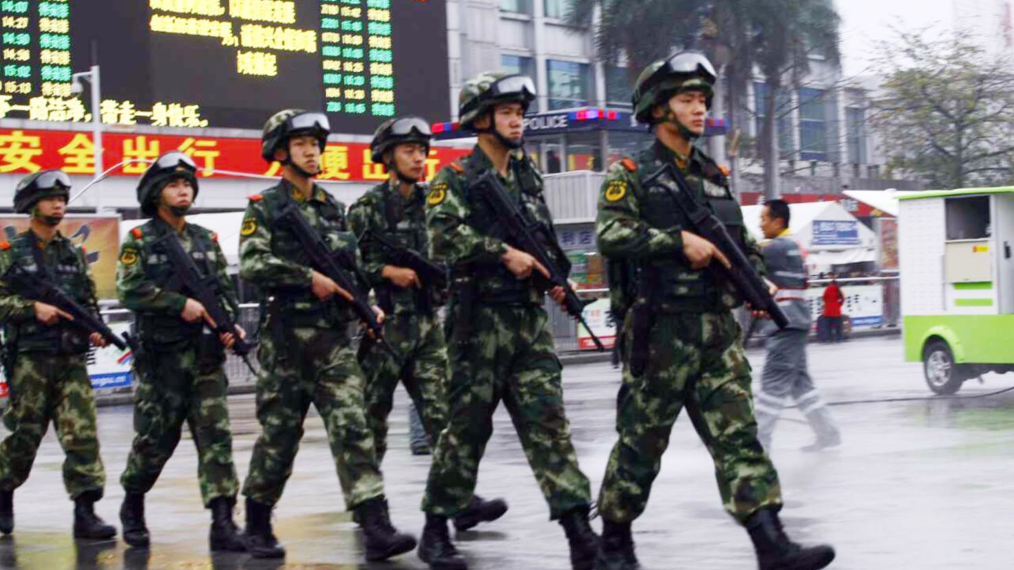 Armed Chinese paramilitary policemen patrol  Guangzhou Railway Station after knife-wielding assailants attacked people on March 6, 2015. 