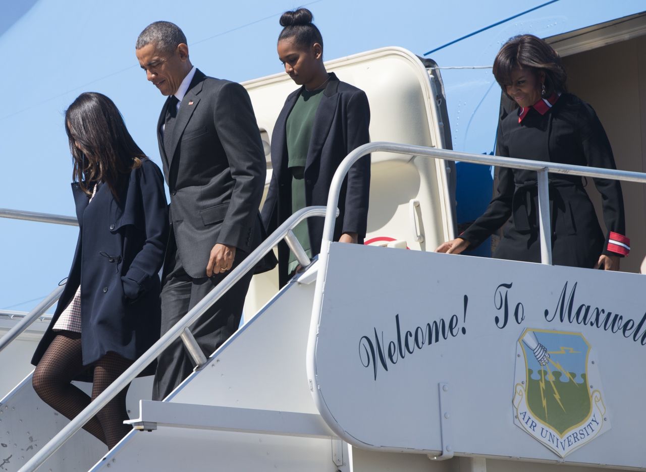 President Obama, first lady Michelle Obama and their daughters, Malia and Sasha, disembark from Air Force One upon arrival at Maxwell Air Force Base in Montgomery, Alabama.