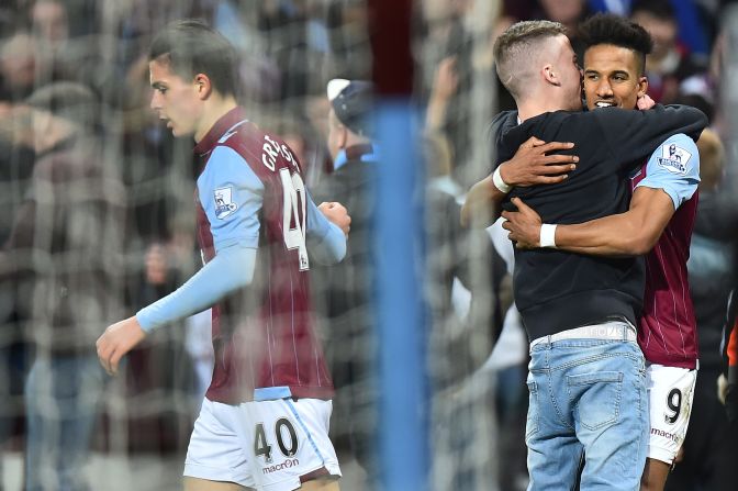 A sole fan runs on to congratulate Villa striker Scott Sinclair after he made it 2-0 to the home side late in the second period.