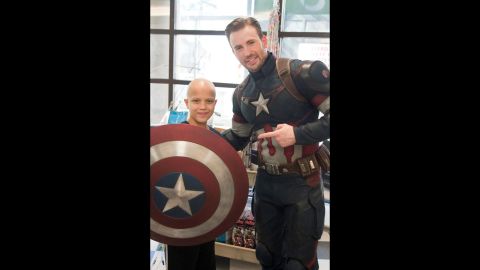 Evans showed up in full Captain America regalia bearing gifts for the young patients.
