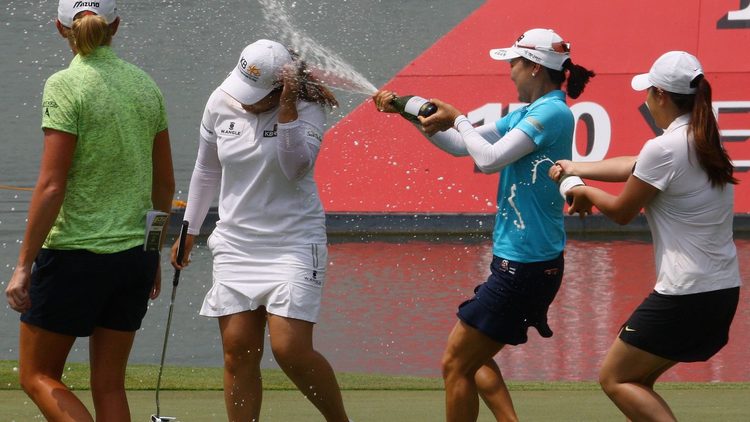 Inbee Park is drenched with bubbly after winning the HSBC Women's Champions at Sentosa Golf Club.