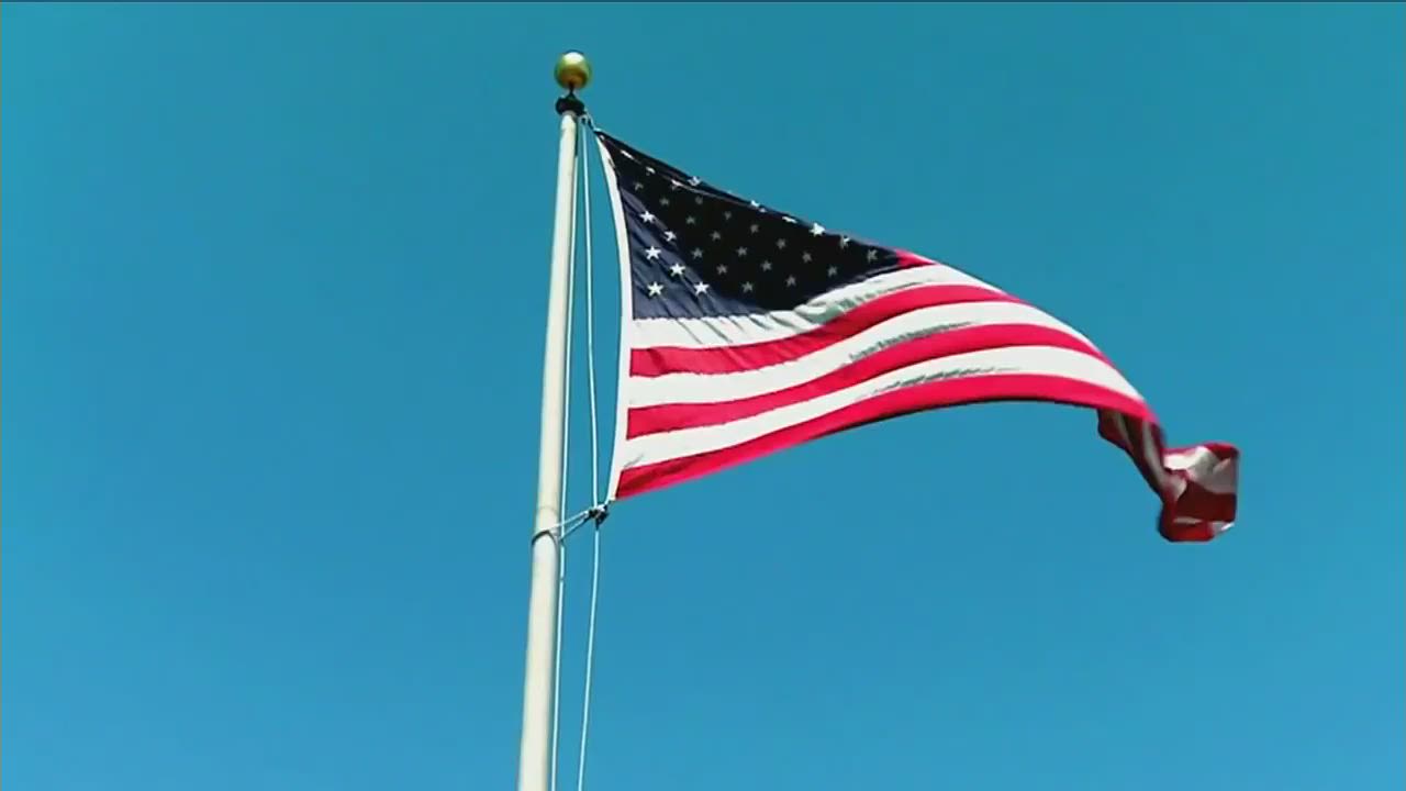 Inglewood, CA, USA, January 2022: The flag of the 56th Super Bowl waving in  the wind with the US national flag blurred in the foreground. The game is  Stock Photo - Alamy