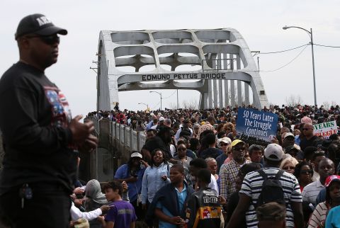 Thousands of people walk across the Edmund Pettus Bridge during the 50th anniversary commemoration of the Selma-to-Montgomery civil rights march on March 8, 2015, in Alabama.  A violent confrontation with police and state troopers on the bridge in 1965 is one of the most memorable events of the civil rights movement. Click through the gallery for more images of the commemoration: