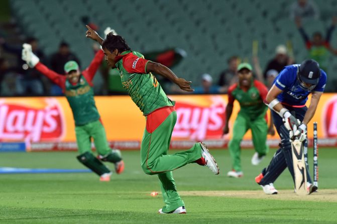 Bangladesh bowler Rubel Hossain celebrates dismissing England's last batsman, James Anderson, to seal a famous victory that saw his side through to the quarterfinals of the cricket World Cup. Defeat confirmed England's exit before the group stage has even finished.
