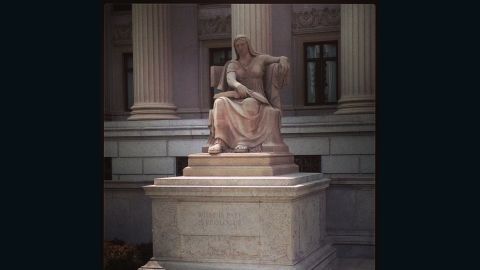 "The Future" sits in front of the National Archives and is a 1935 Robert Aitken sculpture of a woman seated, holding an open book, over the inscription, "What is Past is Prologue."