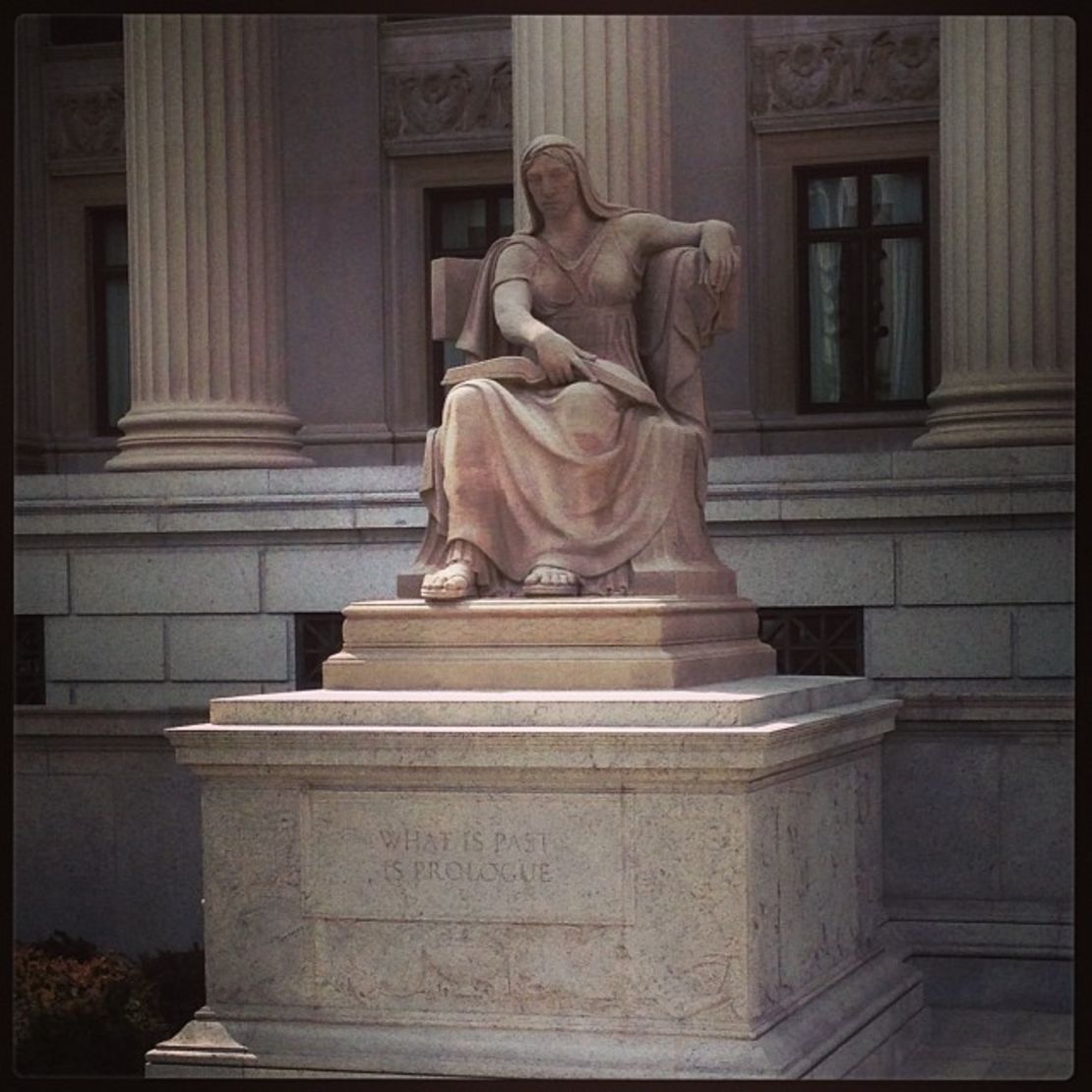 "The Future" sits in front of the National Archives and is a 1935 Robert Aitken sculpture of a woman seated, holding an open book, over the inscription, "What is Past is Prologue."