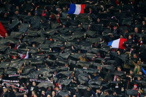 In Eastern France fans held aloft black flags in tribute to the victims at a match between Reims and Saint-Etienne at the Auguste Delaune stadium.