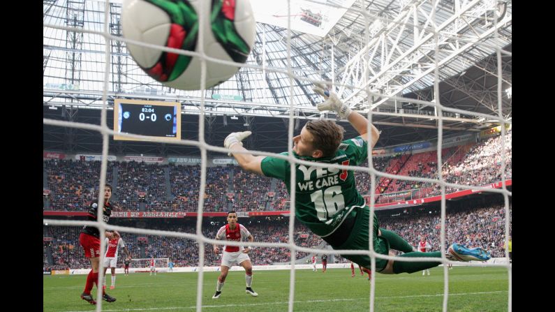 A header from Ajax's Anwar El Ghazi, center, flies past Excelsior goalkeeper Alessandro Damen during an Eredivisie match in Amsterdam, Netherlands, on Sunday, March 8. It was the only goal in the match.
