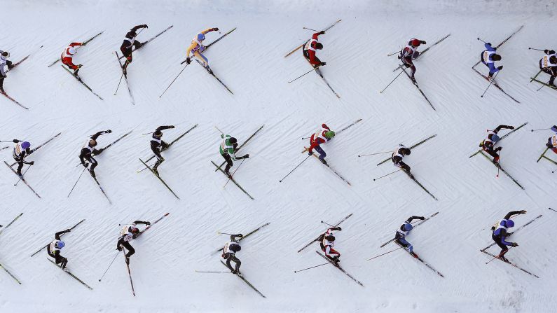 An aerial view shows cross-country skiers climbing a hill during the Engadin Ski Marathon, held Sunday, March 8, near the Swiss mountain resort of St. Moritz.