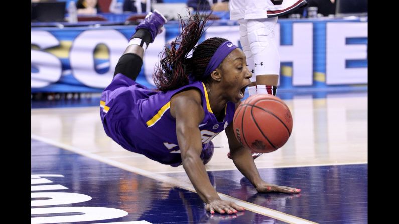 LSU guard Raigyne Moncrief falls to the floor after being fouled during an SEC Tournament game Saturday, March 7, in North Little Rock, Arkansas.