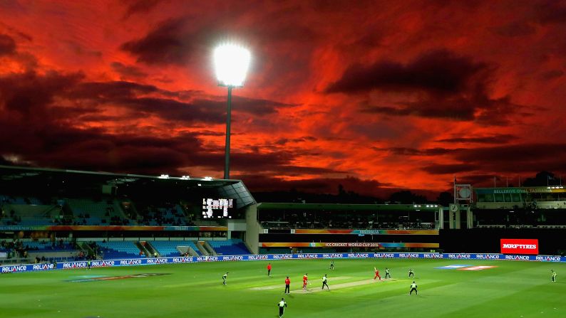 A red sky is seen over Hobart, Australia, as Ireland plays Zimbabwe in a Cricket World Cup match on Saturday, March 7.
