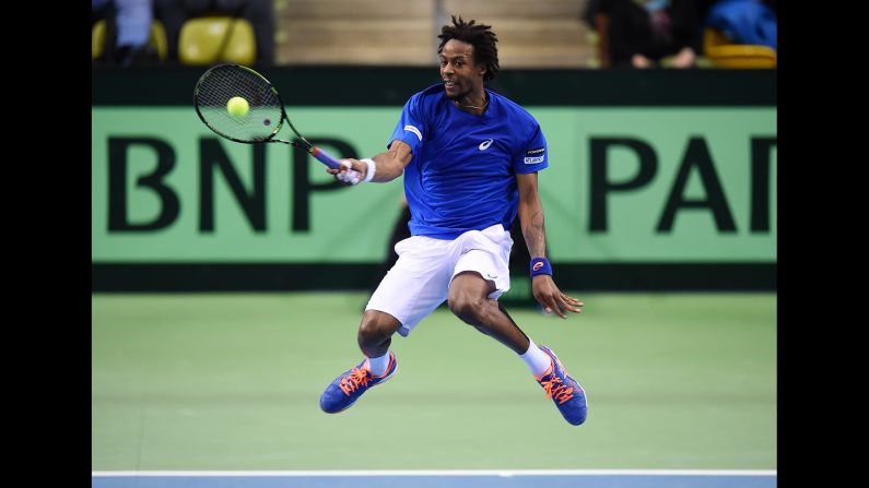 France's Gael Monfils hits a shot while playing Germany's Philipp Kohlschreiber in a Davis Cup match Friday, March 6, in Frankfurt, Germany. Monfils won the match in straight sets, and France would eventually advance to the next round with a 3-2 victory.