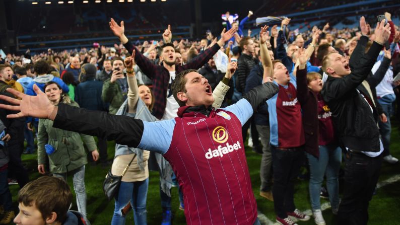 Aston Villa fans <a href="index.php?page=&url=http%3A%2F%2Fwww.cnn.com%2F2015%2F03%2F07%2Ffootball%2Fgallery%2Faston-villa-pitch-invasion%2Findex.html" target="_blank">celebrate victory on the field</a> after their club defeated one of its rivals, West Bromwich Albion, in an FA Cup quarterfinal match Saturday, March 7, in Birmingham, England.