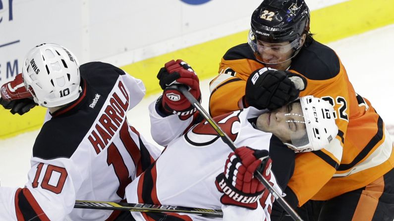 Philadelphia's Luke Schenn hits New Jersey's Tuomo Ruutu during an NHL hockey game Sunday, March 8, in Newark, New Jersey.