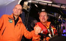 Swiss pilot Bertrand Piccard and his compatriot pilot Andre Borschberg pose for a picture before flying with the Solar Impulse 2 from al-Bateen airport in Abu Dhabi on March 9, 2015. 