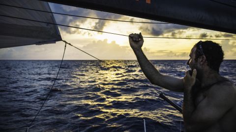 Sailor Seb Marsset looks across the ocean. Over the equator and into the Southern Hemisphere, the weather turns tropical, with rainclouds driving much of the day's movement south towards Vanuatu.