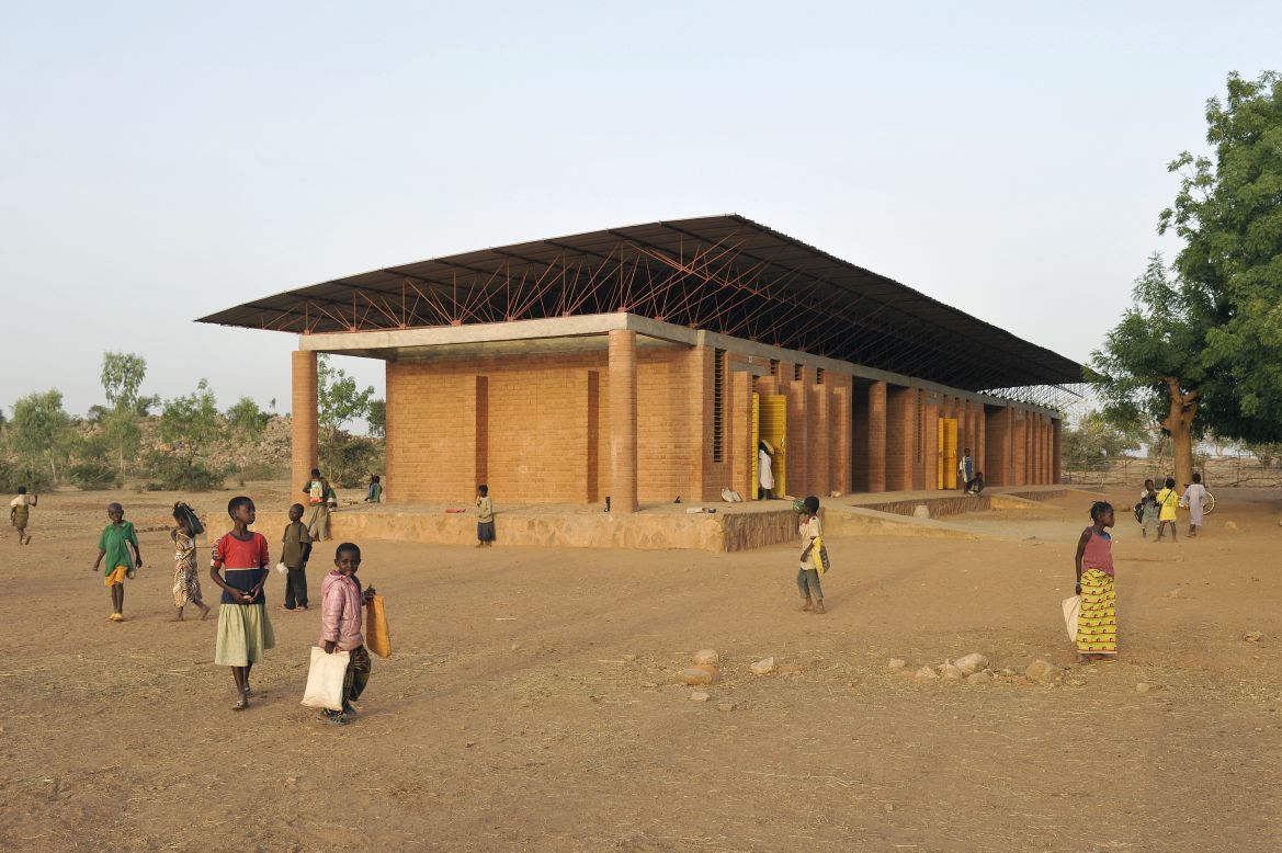 The very first building celebrated architect Francis Kere designed is a school. As a child in Gando, Burkina Faso he had to travel nearly 25 miles to the next village to get to class. His school had poor lighting and ventilation, and it was a struggle to learn in that environment. Whilst studying architecture in Europe, he developed construction strategies that combined traditional Burkinabe building techniques and materials with modern engineering methods. The school was completed in 2001.