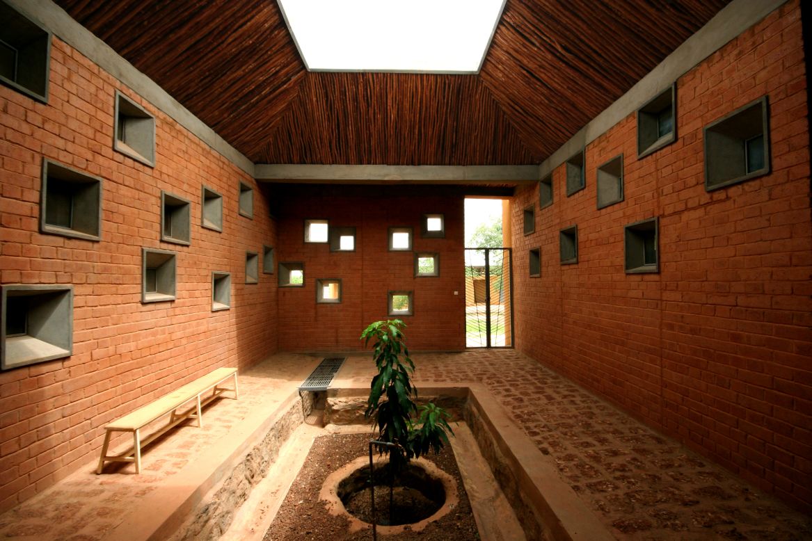 Kéré also designed the medical facility Centre de Santé et de Promotion Sociale in Laongo, Burkina Faso. The center consists of three medical units organized around a central waiting area. Several shaded courtyards were incorporated into the design so visitors and family can be comfortable while they wait. Local clay and stone were used in the walls for extra rain protection. Locally available eucalyptus wood, seen as an environmental nuisance as it contributes to desertification, is used to line the suspended ceilings and covered walkways of the center.
