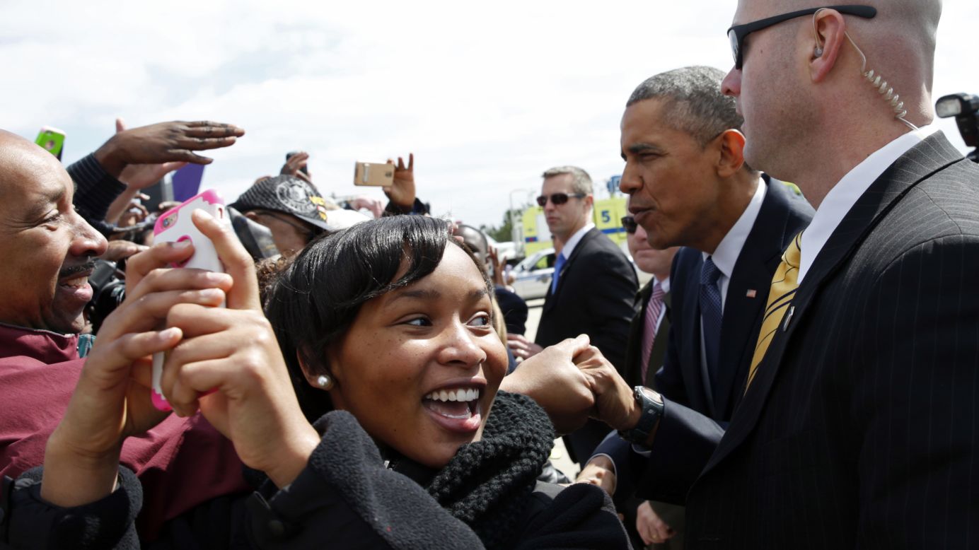 A girl takes a selfie as U.S. President Barack Obama greets supporters in Columbia, South Carolina, on Friday, March 6.