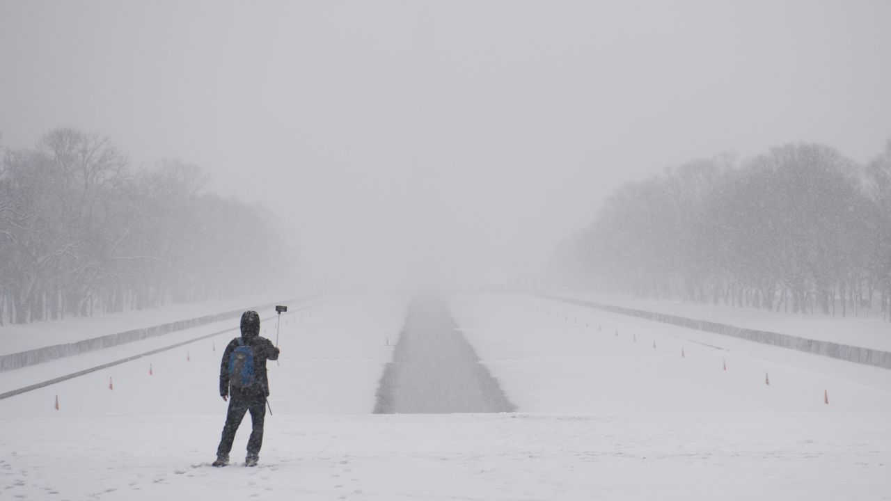 A man uses a selfie stick on the National Mall during a heavy snowstorm in Washington on Thursday, March 5.