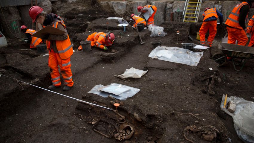 Archaeologists excavate the 16th and 17th century Bedlam burial ground uncovered by work on the new Crossrail train line next to Liverpool Street station in London, Friday, March 6, 2015. The excavation team estimate there to be 3,000 human skeletons at the site, which was a burial ground to the then adjacent Bedlam Hospital, the world's first psychiatric asylum. The 118-kilometer (73-mile) Crossrail project to put a new rail line from west to east London is Britain's biggest construction project and the largest archeological dig in London for decades.