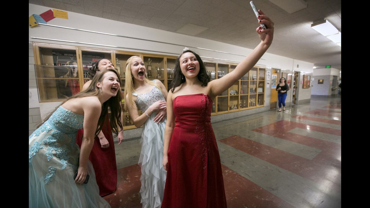 Jasnery Valenzuela, the outgoing Rose Festival princess for Portland, Oregon's Lincoln High School, takes a selfie with this year's princess candidates on Thursday, March 5.