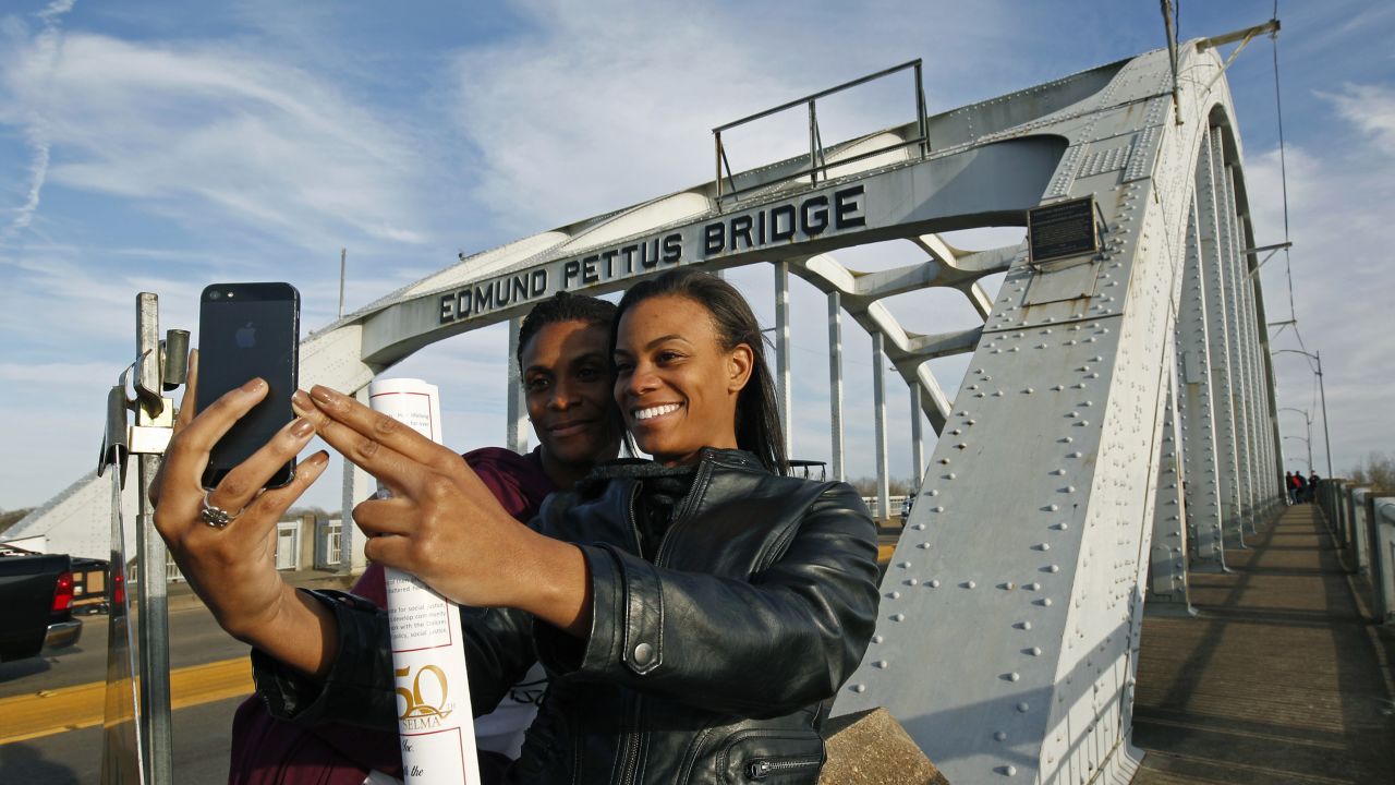 Lazette Bowens, left, and her daughter Zoe take a selfie at the Edmund Pettus Bridge in Selma, Alabama, on Friday, March 6. Fifty years ago, state troopers <a href="http://www.cnn.com/2015/01/06/us/gallery/selma-bloody-sunday-1965/index.html" target="_blank">used brutal force and tear gas at the bridge</a> to push back hundreds of people marching to protest discriminatory practices. What the marchers did years ago "will reverberate through the ages," <a href="http://www.cnn.com/2015/03/07/us/selma-50-years-anniversary-live-events/index.html" target="_blank">President Obama said</a> on Saturday, March 7. "Not because the change they won was preordained; not because their victory was complete; but because they proved that nonviolent change is possible; that love and hope can conquer hate."