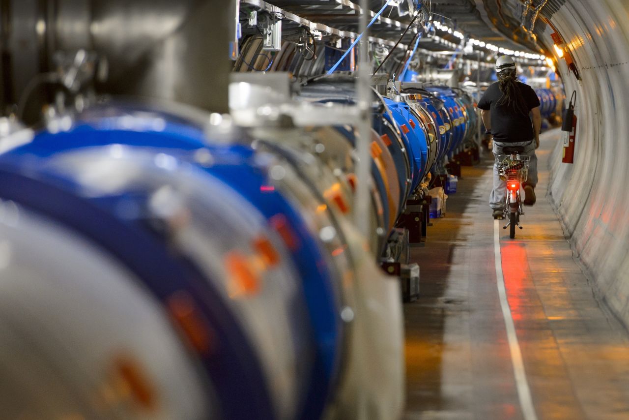 The particle accelerator is the largest machine in the world and runs underground in a 27km (17 mile) circumference tunnel on the Franco-Swiss border.
