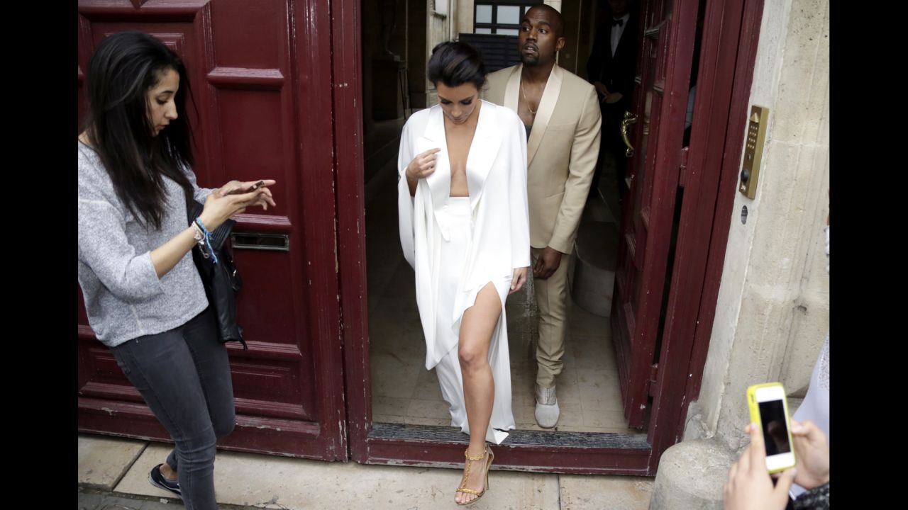 Kim Kardashian and Kanye West leave their residence in Paris in May 2014, ahead of their wedding.  West and his bride-to-be reportedly lunched at a French chateau owned by iconic designer Valentino.