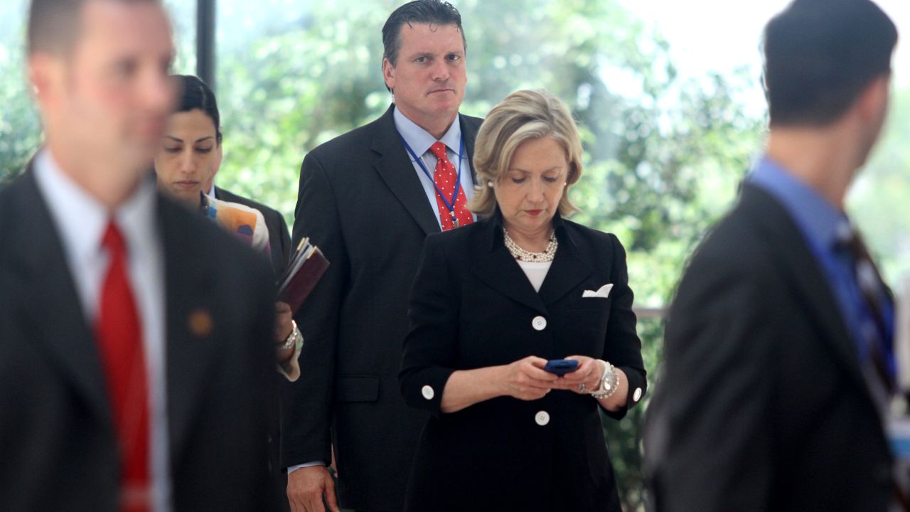 Clinton looks at her phone after attending a Russia-U.S. meeting in Hanoi, Vietnam, in July 2010.