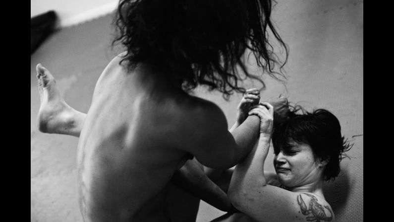 A fighter nicknamed Red Devil, bottom, takes on Belgian wrestler Nadege.