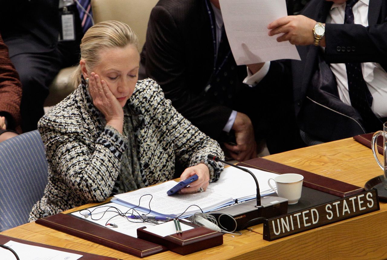 Clinton checks her phone after addressing the U.N. Security Council in March 2012.