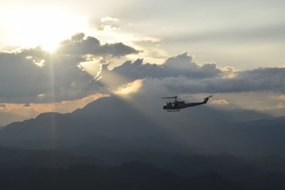 A Guatemalan National Civil Police helicopter approaches the Guatemalan Air Force base at La Aurora International Airport in Guatemala City.