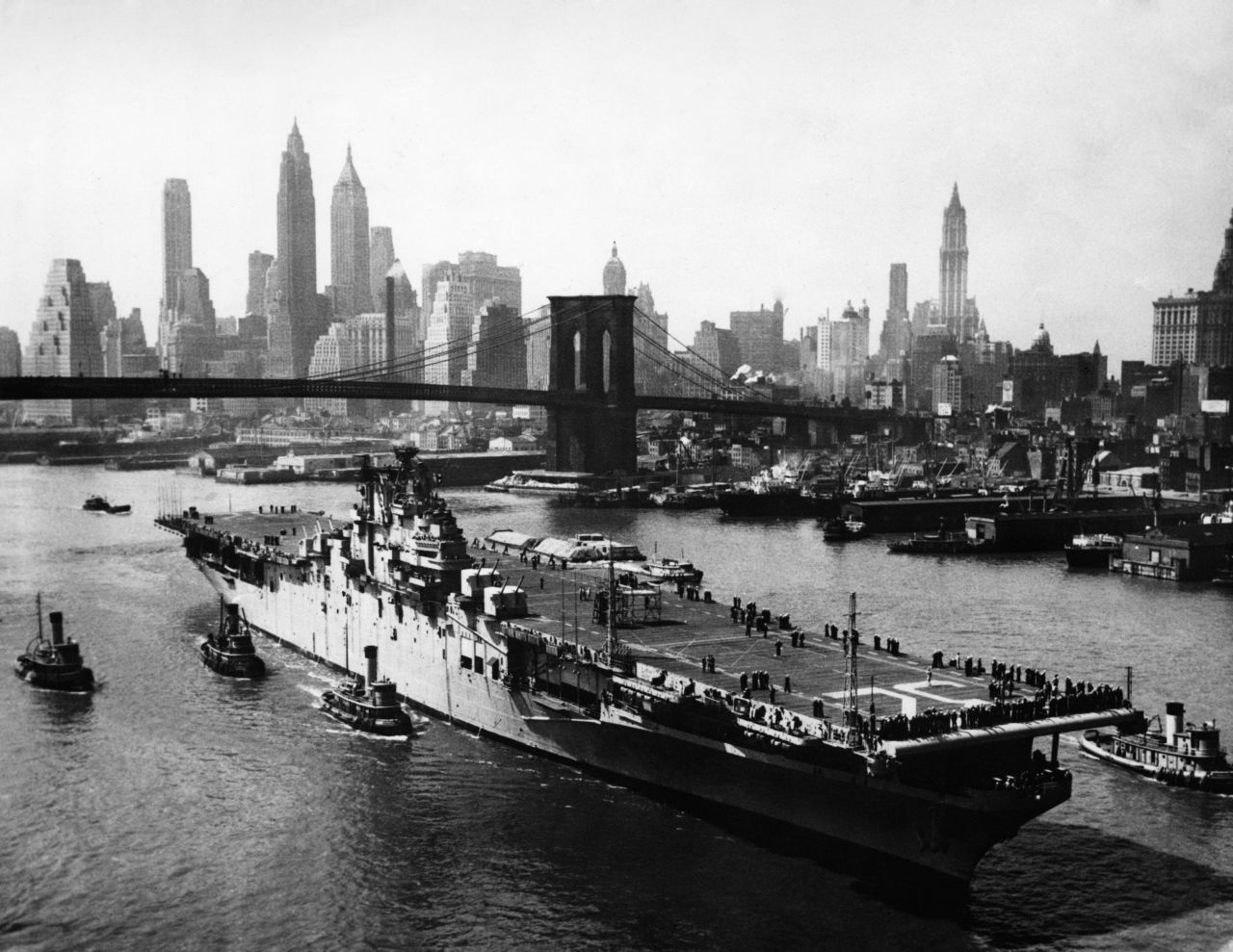 The USS Leyte passes up the East River en route to the Brooklyn Navy Yard in 1948. 