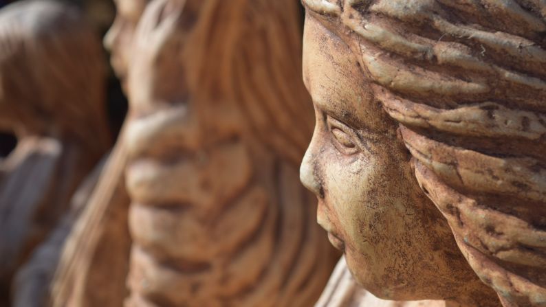 Statues of children-like angels decorate a building in rural Honduras.