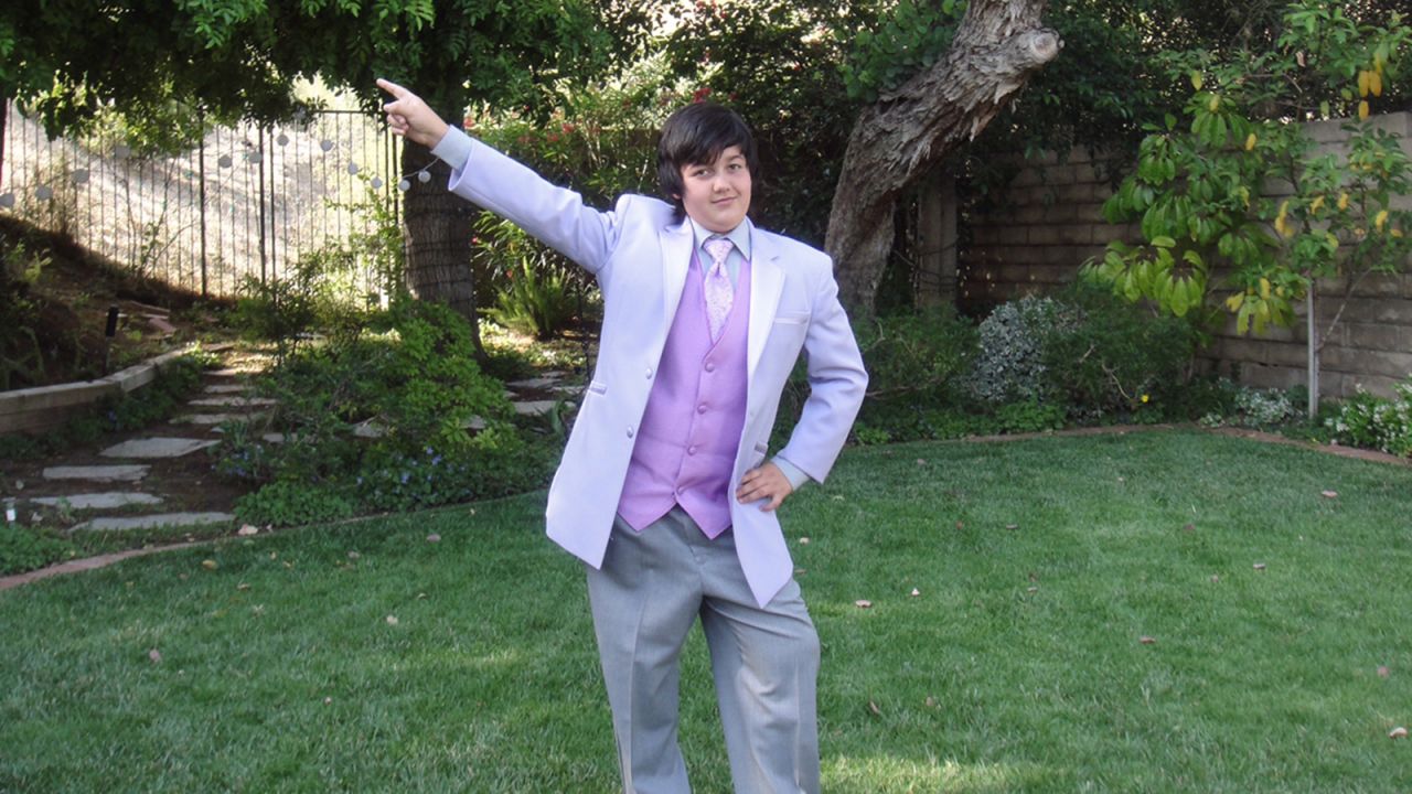 Avery wore a suit with a lavender vest to his fifth-grade graduation party in 2010.