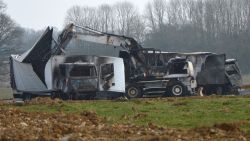 Burnt out vans are seen near the Avallon motorway exit, central France, Wednesday, March 11, 2015. A police official says 15 armed assailants attacked two vans on a French highway carrying millions of euros worth of jewels, and sped away. The official says the two vans were found burned in a forest near the site of the attack, which happened on the A6 highway connecting Paris and Lyon. The jewels were not found. (AP Photo)