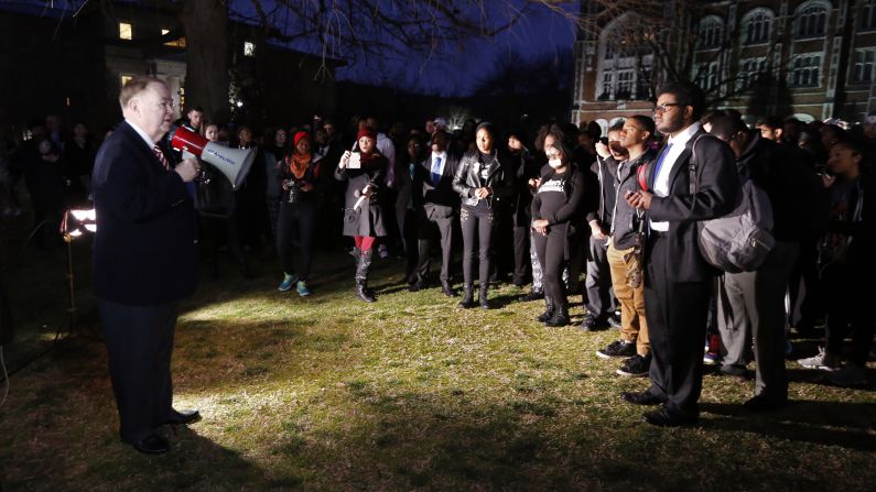 Boren, with the bullhorn at left, speaks with students as they protest on March 9. "I have a message for those who have misused their freedom of speech in this way," he said. "My message to them is: You're disgraceful. You have violated every principle that this university stands for."